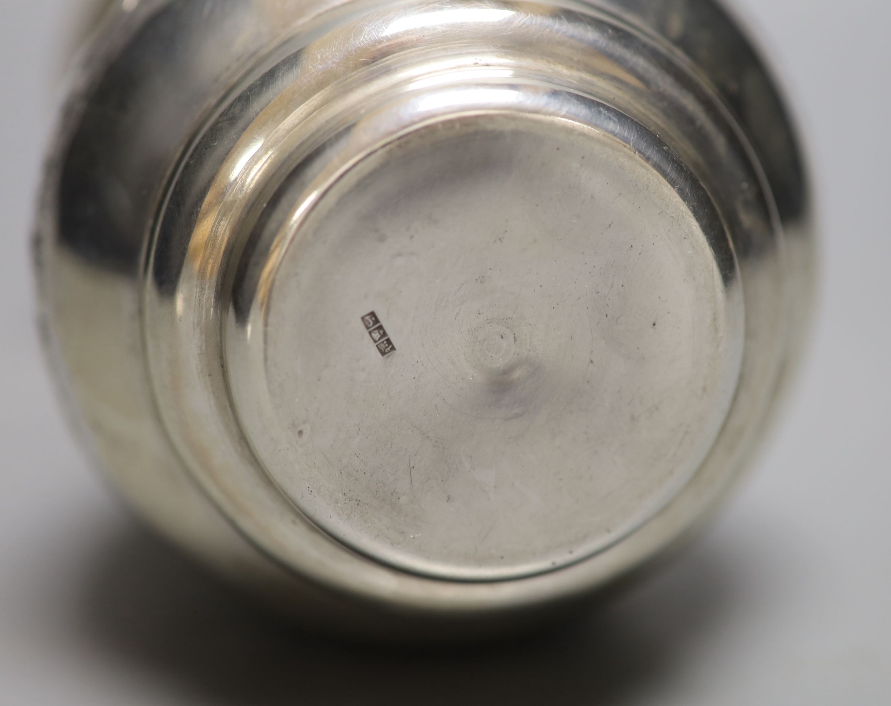 A post 1946 Egyptian embossed white metal baluster vase, 17.5cm,